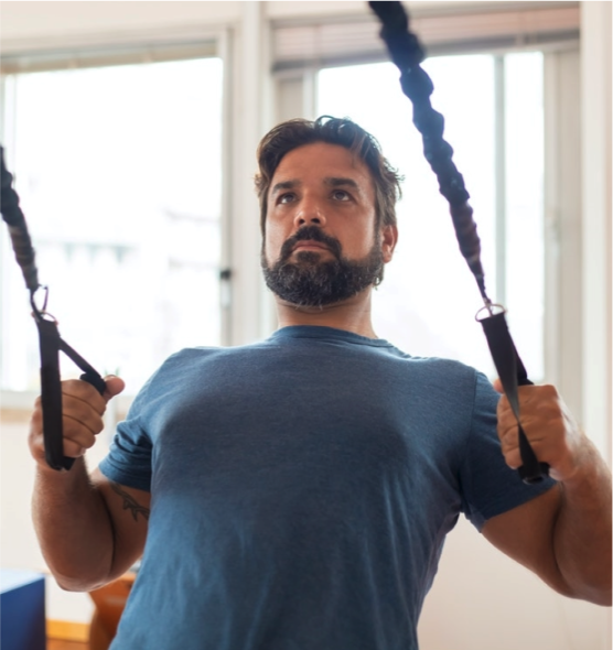 man using pulldown weights